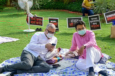 TMC MP Derek O'Brien and Congress MP Rajiv Satav R stage a protest over their suspension from the remaining Monsoon Session of Parliament. (Photo | PTI)