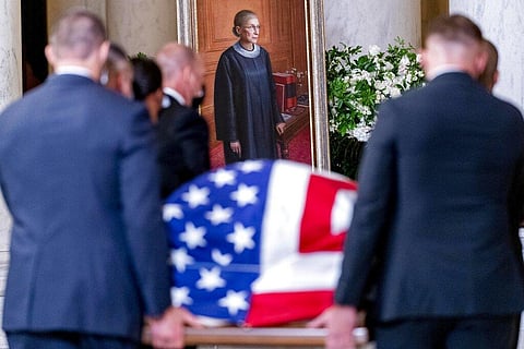 The flag-draped casket of Justice Ruth Bader Ginsburg, carried by Supreme Court police officers, arrives in the Great Hall at the Supreme Court in Washington. (Photo | AP)