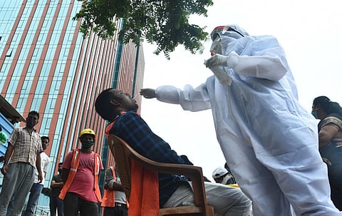 Chennai corporation collecting swabs from migrant workers who are working at a construction site at OMR (File Photo | Ashwin Prasath, EPS)