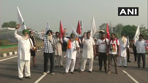Farmers, under the aegis of Bharatiya Kisan Union and Revolutionary Marxist Party of India (RMPI), block Amritsar-Delhi National Highway near Phillaur in Jalandhar. (Photo | ANI Twitter)
