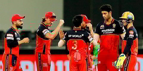 Royal Challengers Bangalore players celebrate the wicket of Kings XI Punjab batsman Mayank Agarwal. (Photo | PTI)