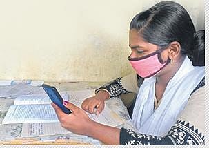 A student accesses the internet for online studies in the house of Sagar Naik  | Express