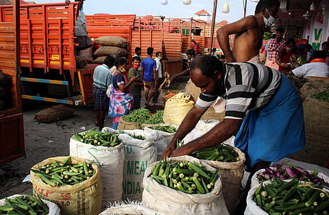Traders at Koyembedu vegetable market on the first day of its reopening on Monday (Photo | Debadatta Mallick, EPS)