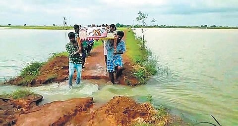 Brahmanapalle villagers carrying the unwell man on a cot who later succumbed to his illness.  (Photo | Express)