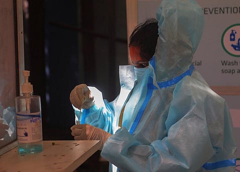 A health worker collects a nasal swab sample to test for COVID-19 in Hyderabad, India, Tuesday, Sept. 22, 2020. (Photo | AP)