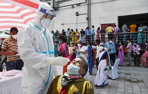 A health worker takes samples for COVID-19 Rapid Antigen Tests as coronavirus cases surge across the city in Guwahati Tuesday Sept. 29 2020. (Photo | PTI)