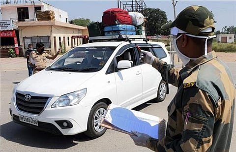 A BSF jawan checks the names of Pakistani nationals at Wagah border post (Photo | AFP)