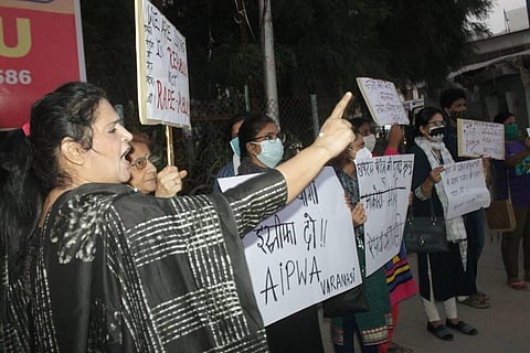 All India Progressive Women's Association activists stage a protest over the death of Hathras gangrape victim outside Banaras Hindu University in Varanasi. (Photo | PTI)