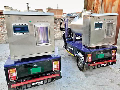 The two e-rickshaws fitted with milk ATMs procured by VGS