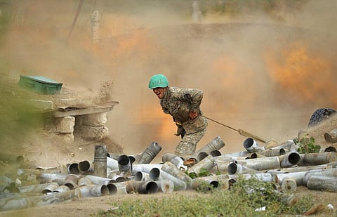 An Armenian serviceman fires a cannon towards Azerbaijan positions in the self-proclaimed Republic of Nagorno-Karabakh, Azerbaijan, Tuesday, Sept. 29, 2020. (Photo | AP)