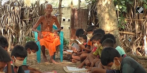 A screengrab of Nanda Prasty teaching the children. (Youtube/ANI News)