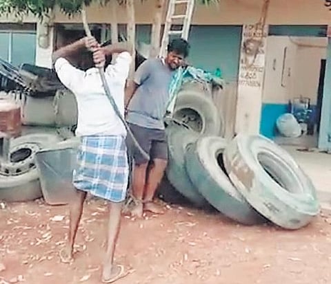 A private transport company management staff beating a lorry driver at Muddanur in Kadapa district on Thursday. (Photo | EPS)