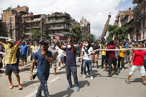 Nepalese protestors defying a government coronavirus lockdown to take part in a religious festival gather in Lalitpur. (Photo | AP)