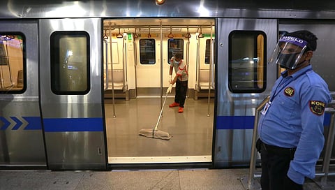 DMRC employees sanitise a coach during a media preview as the Delhi Metro network prepares to resume services partially after more than 5 months shut down due to Covid-19. (Photo | Shekhar Yadav, EPS)