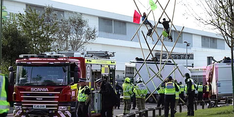 Police and fire services at the scene, outside Broxbourne newsprinters as protesters continue to block the road, in Hertfordshire, England. (Photo| AP)