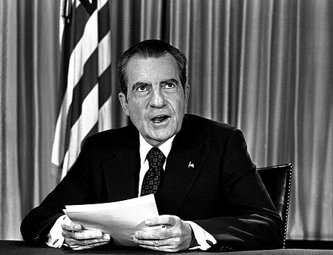 Richard Nixon sits in his white house office, as he poses for pictures after delivering a nation wide television address dealing with water gate. (Photo| AP)