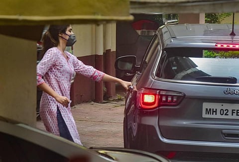 Rhea Chakraborty leaves for NCB office after being summoned for questioning in connection with the death by suicide case of Sushant Singh Rajput at Santacruz in Mumbai Sunday. (Photo | PTI)