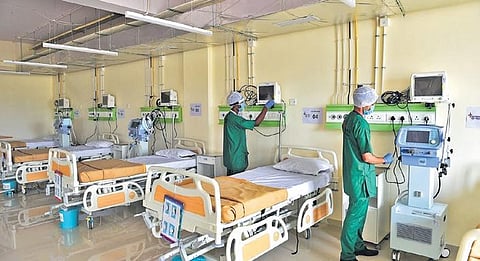 Workers set up an ICU ward for Covid patients in Charaka Hospital in Bengaluru