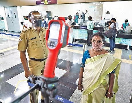 Kochi Metro reopened on Monday with the required Covid-19 protocol in place.  A commuter under going thermal scanning at a metro station , Arun Angela