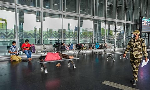 Passengers wait at NSCBI Airport during the bi-weekly lockdown in the wake of coronavirus pandemic in Kolkata Monday Sept. 7 2020. (Photo | PTI)