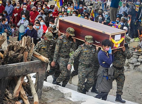 Army soldiers carry the mortal remains of martyr Nyima Tenzin who laid down his life in a face-off with China on Aug 30 during his funeral in Leh Monday Sept. 7 2020. (Photo | PTI)