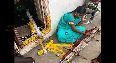 Weavers in Andhra Pradesh work on the handloom.