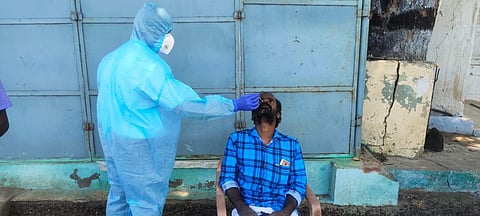 Health staff collecting nasal swabs of people without masks in Pollachi on Tuesday. (Photo | Express)