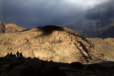 In this Sept. 14, 2018, file photo, Border Roads Organization workers rest near Pangong Lake in Ladakh region, India. (Photo | AP)