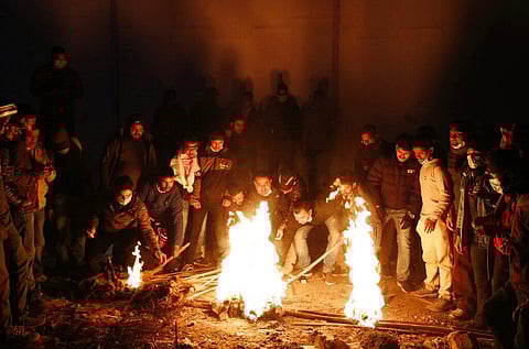 Nepalese demonstrators participate in a torch rally to protest against the dissolution of parliament in Kathmandu, Nepal. (Photo | AP)