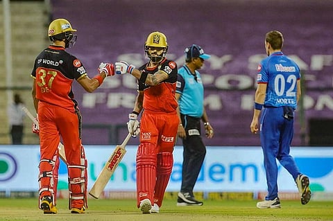 Virat Kohli and Devdutt Padikkal of Royal Challengers Bangalore during IPL 2020 match against Delhi Capitals at Sheikh Zayed Stadium in Abu Dhabi. (Photo | PTI)