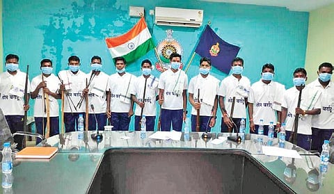Surrendered Maoist cadres with their weapons at a press conference; (right) rebels, who have given up their arms, pledge support to the ‘Lon Varratu’ campaign in a village. (Photo | Express)