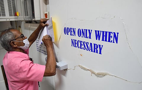 A health official on a routine inspection of the vaccine cold storage at a centre in Bengaluru. (Photo | Shriram BN, EPS)