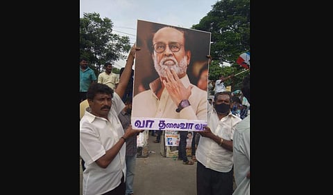 Members of Rajinikanth's fan club stage demonstration at Valluvar Kottam in Chennai. (Photo | EPS)