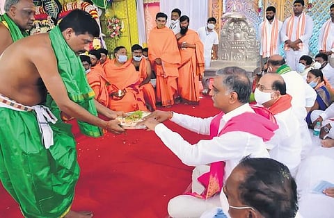 Finance Minister T Harish Rao performs a special puja at the Sri Mallikarjuna Swamy temple at Komuravelly on Sunday.