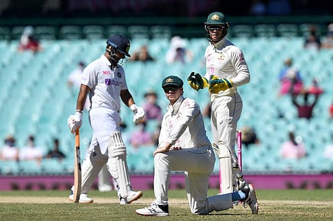 Steve Smith (C) of Australia looks on after a misfield during day five of the third cricket Test match between Australia and India. (Photo | AFP)