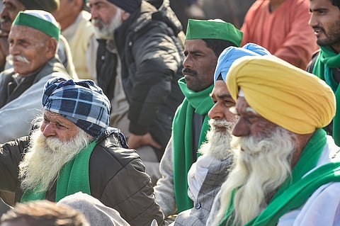 Farmers during their ongoing agitation against new farm laws at Ghazipur border in New Delhi Monday. (Photo | PTI)
