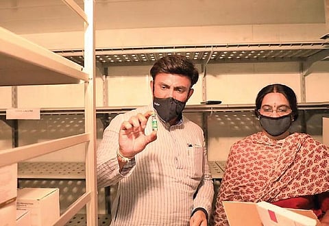 A van carrying the Covishield vaccine consignment on its way to the health department’s storage facility at Anand Rao Circle, in Bengaluru on Tuesday