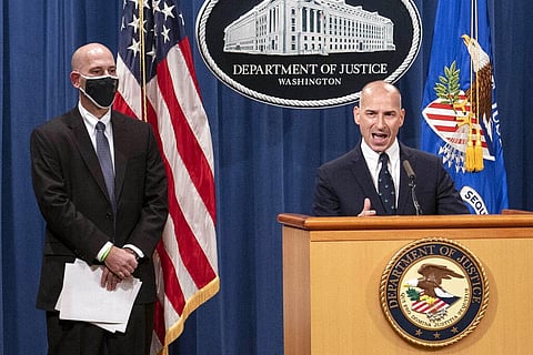 Steven D'Antuono, head of the Federal Bureau of Investigation (FBI) Washington field office, left, listens as acting U.S. Attorney Michael Sherwin. (Photo | AP)