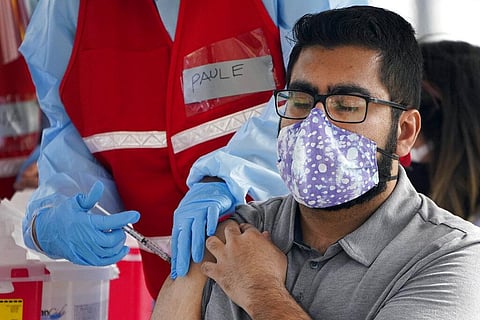 A man receives a COVID-19 vaccine at a site for health care workers at Ritchie Valens Recreation Center, Wednesday, Jan. 13, 2021, in Pacoima, Calif. (Photo | AP)
