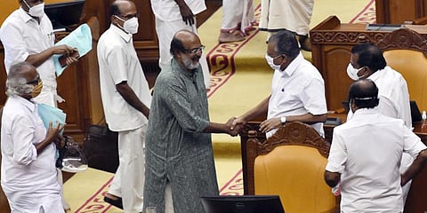 Finance Minister Thomas Isaac greets CM Pinarayi Vijayan after presenting the state budget at the assembly. (Photo | PRD)