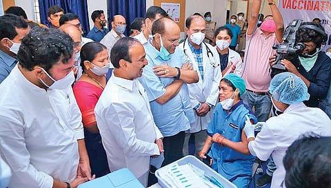S Kistamma, a sanitation worker, gets the first vaccine shot at Gandhi Hospital in Hyderabad on Saturday. (Photo | EPS)