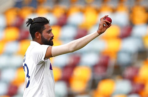 Mohammed Siraj gestures with the ball as he leaves the field after taking five wickets. (Photo | AP)