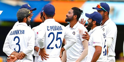 India's Mohammed Siraj, centre, is congratulated by teammates after dismissing Australia's Mitchell Starc. (Photo | AP)