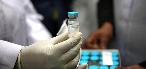 A health official shows a Covaxin vaccine dose at a hospital in New Delhi. (Photo | Shekhar Yadav, EPS)