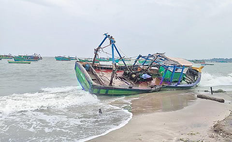 File picture of a damaged fishing boat that washed ashore at Pamban in Rameswaram following cyclone Nivar last month