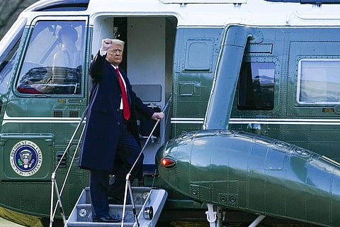 President Donald Trump gestures as he boards Marine One on the South Lawn of the White House, Wednesday, Jan. 20, 2021, in Washington. (Photo | AP)