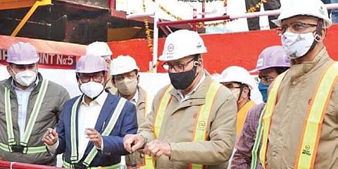 Delhi Metro Rail Corporation officials at the construction site in New Delhi’s Vikaspuri area on Thursday (Photo | EPS)