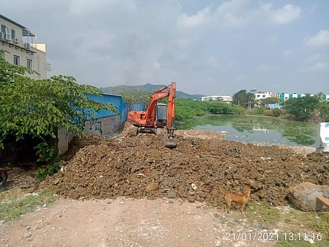 The Pallavaram municipality on Thursday removed the encroachments in the Putheri Lake bund and began digging the mud to expand the lake area (Photo | Special arrangement)