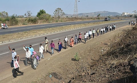 Farmers from Nashik district walk along the Nashik-Mumbai highway to participate in the protest march organized by Akhil Bharatiya Kisan Sabha, scheduled to take place on January 25, in Mumbai. (Photo