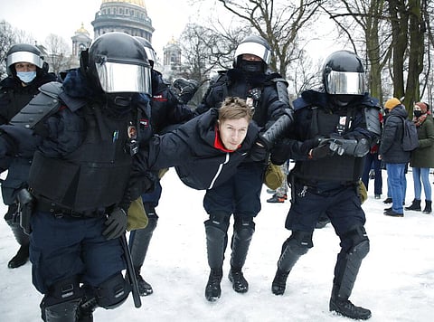 Police detain a man during a protest against the jailing of opposition leader Alexei Navalny in People gather in St.Petersburg, Russia, Saturday. (Photo | AP)